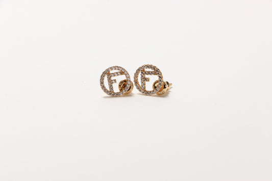 F is Fendi gold  earrings